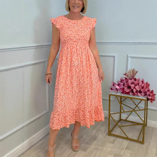 Elegante vestido con estampado floral, cintura alta y mangas con volantes
